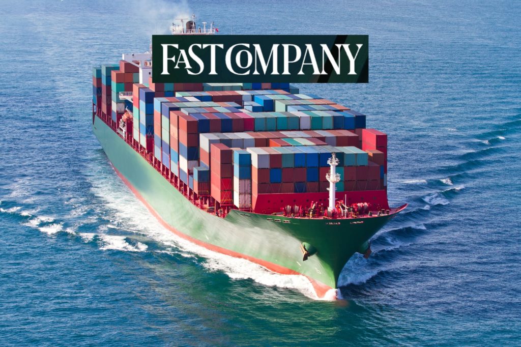 A container ship as sea. The FastCompany logo is superimposed.